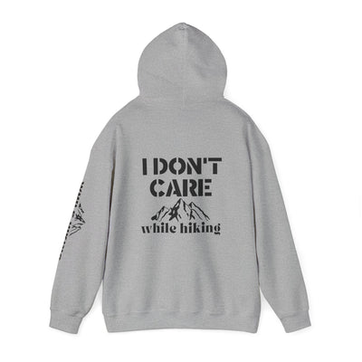 I DON'T CARE WHILE HIKING Unisex Heavy Blend™ Hooded Sweatshirt